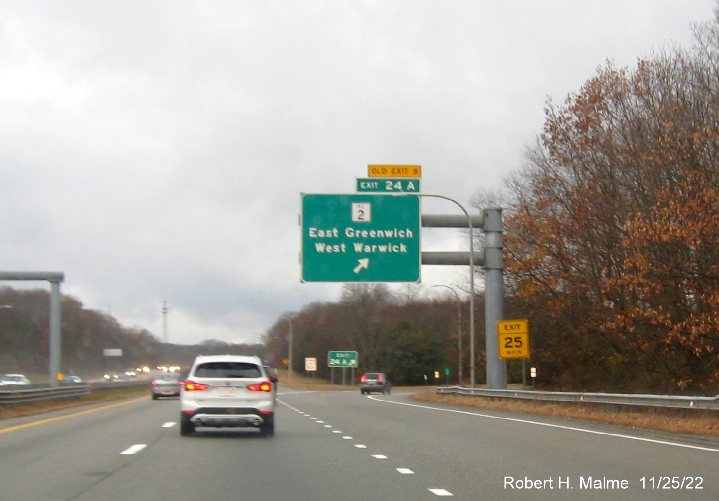 Image of overhead ramp sign for RI 2 exit with new milepost based exit number and yellow Old Exit 8 sign over exit tab on I-95 South in West Warwick, November 2022