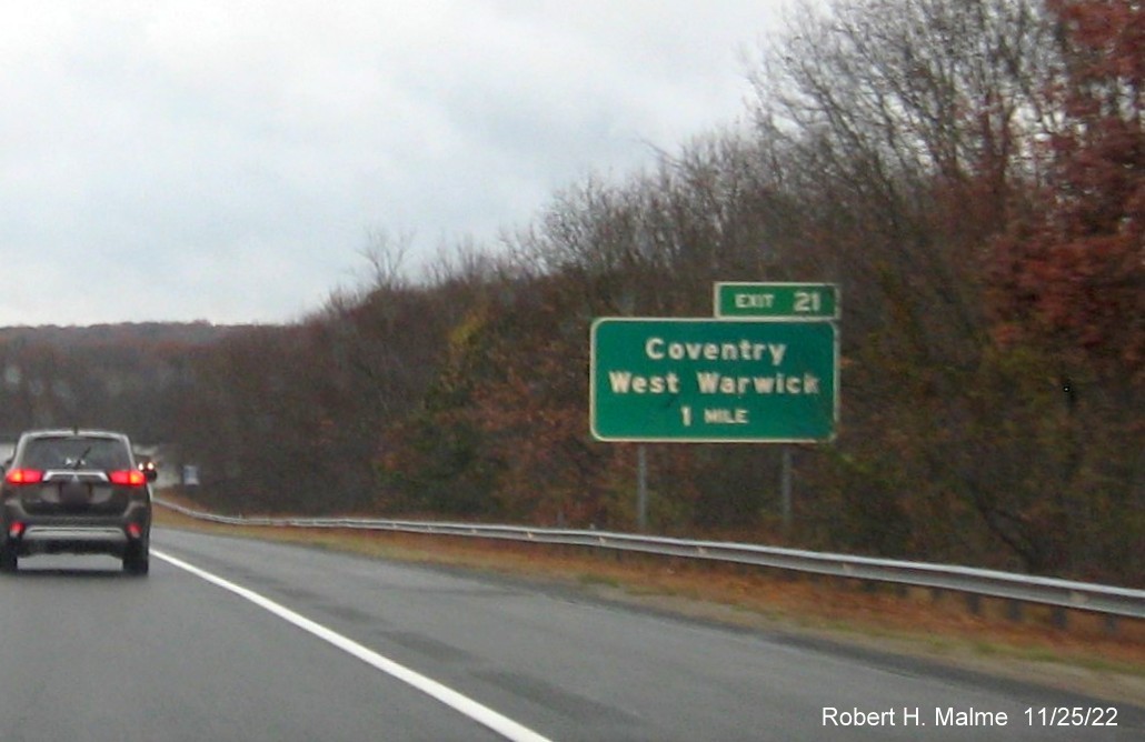 Image of 1 mile advance sign for Coventry/West Warwick exit with new milepost exit number, but no yellow Old Exit sign, on I-95 South, November 2022