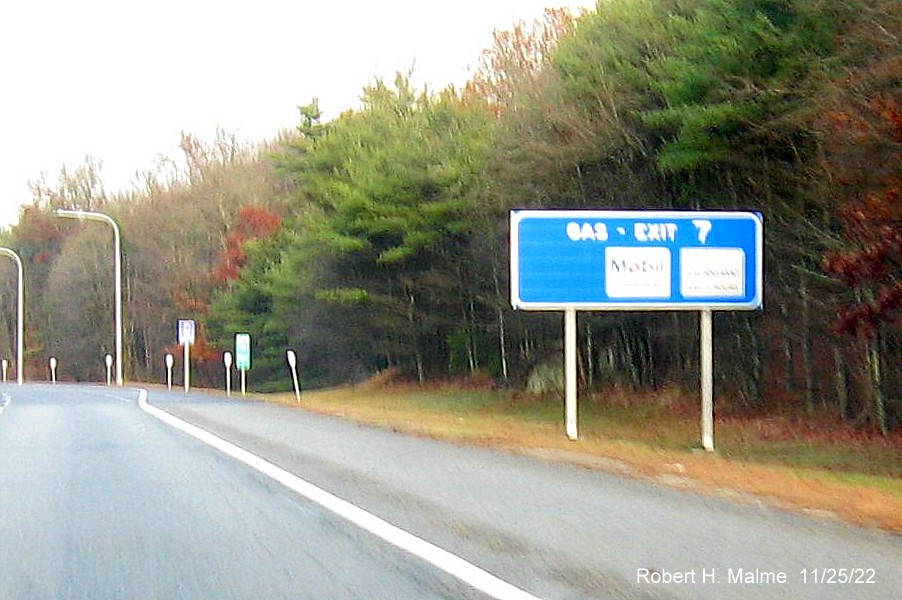 Image of blue gas services sign for RI 138 exit with new milepost based exit number on I-95 North in Wyoming, November 2022