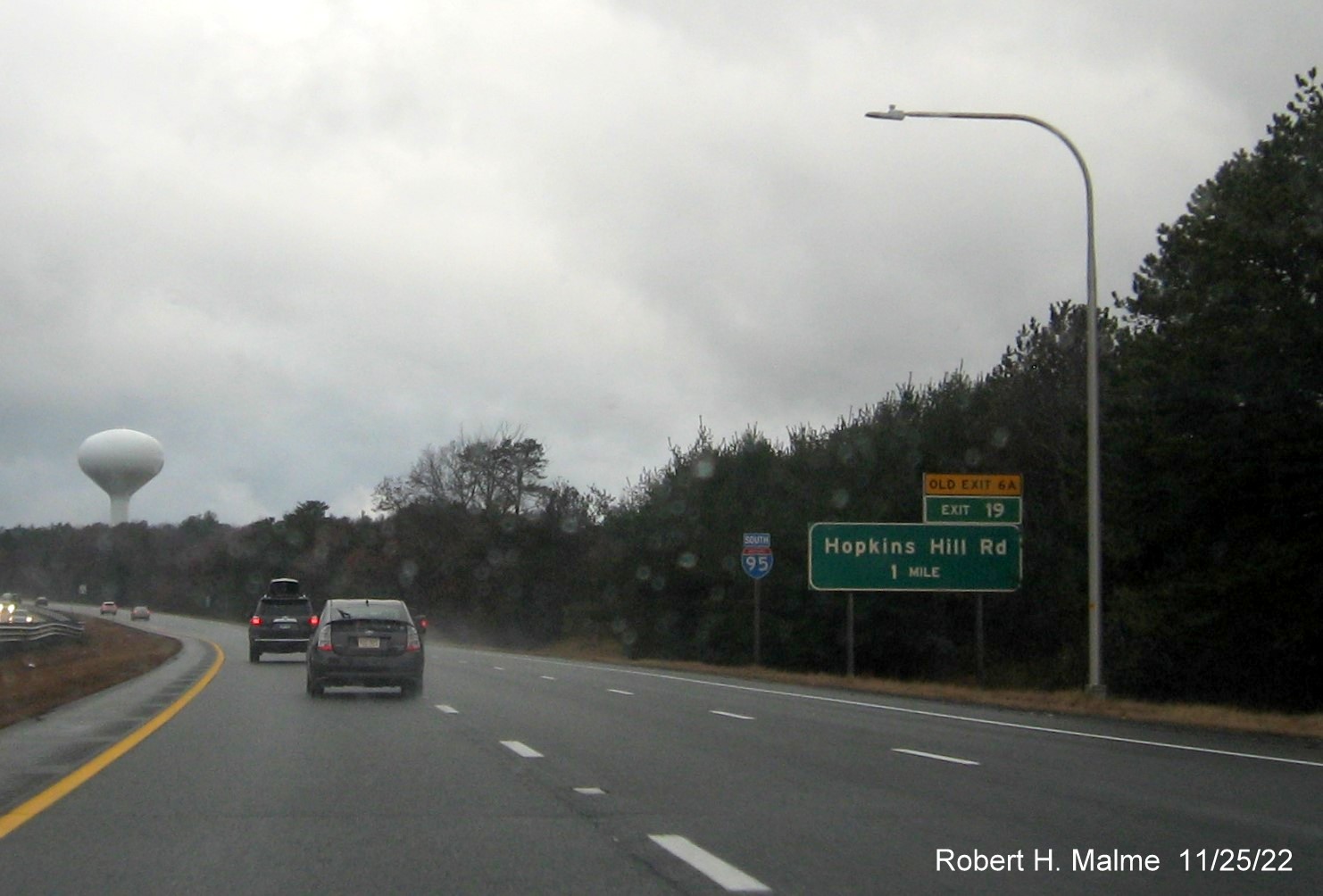 Image of 1 mile advance sign for Old Hopkins Road exit with new milepost exit number, and yellow Old Exit 6A sign above exit tab, on I-95 South in West Warwick, November 2022