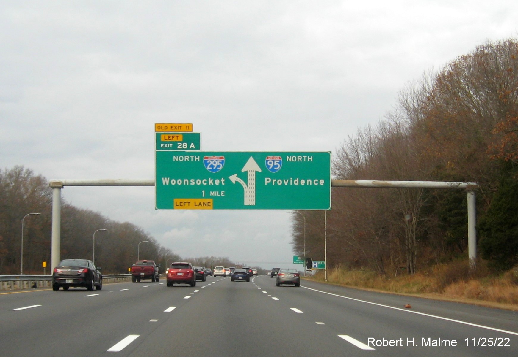 Image of 1 mile advance diagrammatic advance sign for North I-295 exit with new milepost based exit number and yellow Old Exit 11 sign on top of exit tab on I-95 North in Warwick, November 2022
