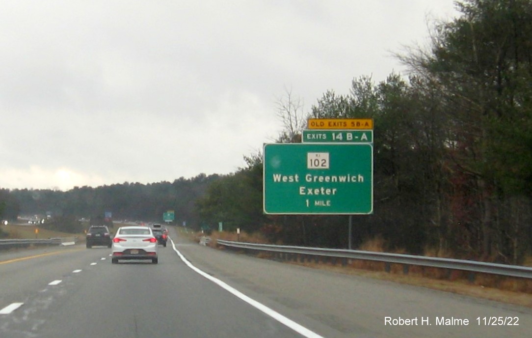Image of ground mounted 1 mile advance sign for RI 102 exits with new milepost based exit numbers and yellow Old Exits 5 B-A sign above exit tab on I-95 South in West Greenwich, November 2022