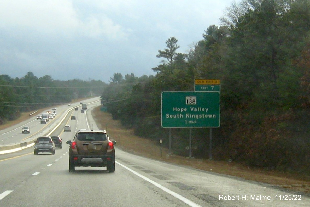 Image of ground mounted 1 mile advance sign for RI 138 exit with new milepost based exit number and yellow Old Exit 3 sign above exit tab on I-95 South in Hope Valley, November 2022