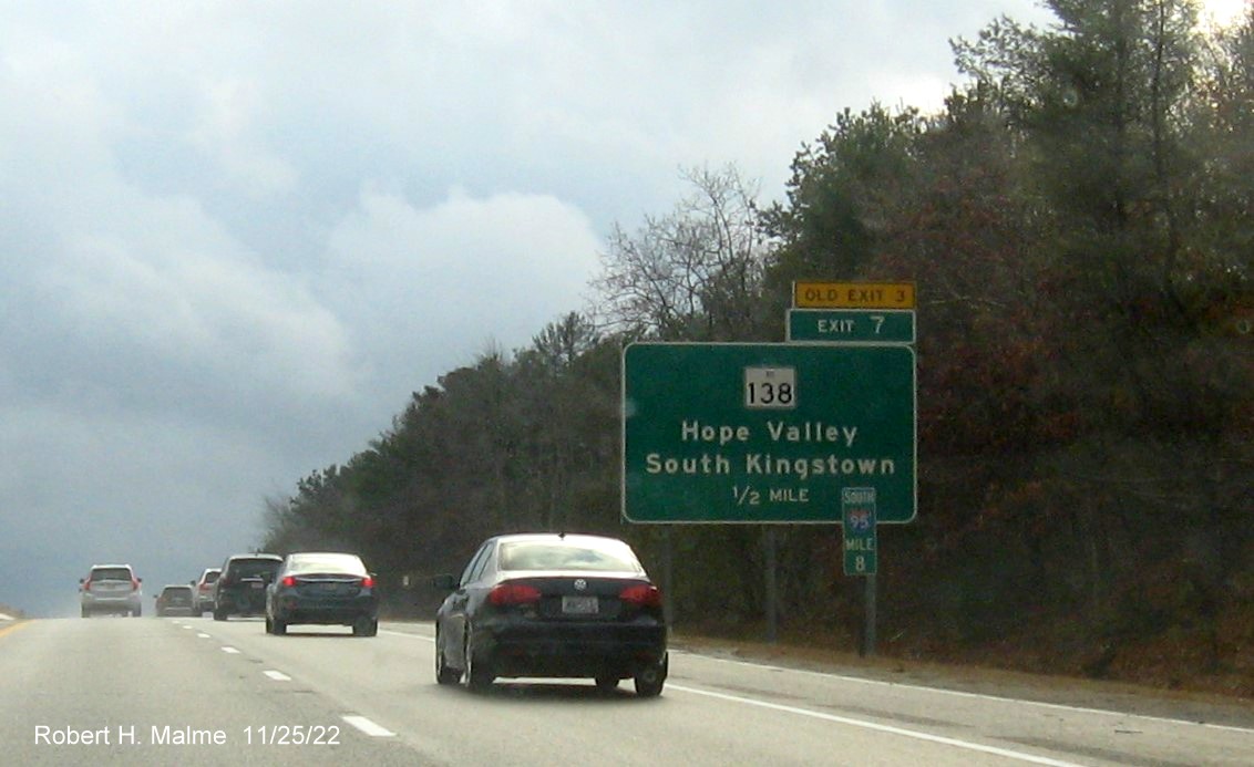 Image of ground mounted 1/2 mile advance sign for RI 138 exit with new milepost based exit number and yellow Old Exit 3 sign above exit tab on I-95 South in Hope Valley, November 2022