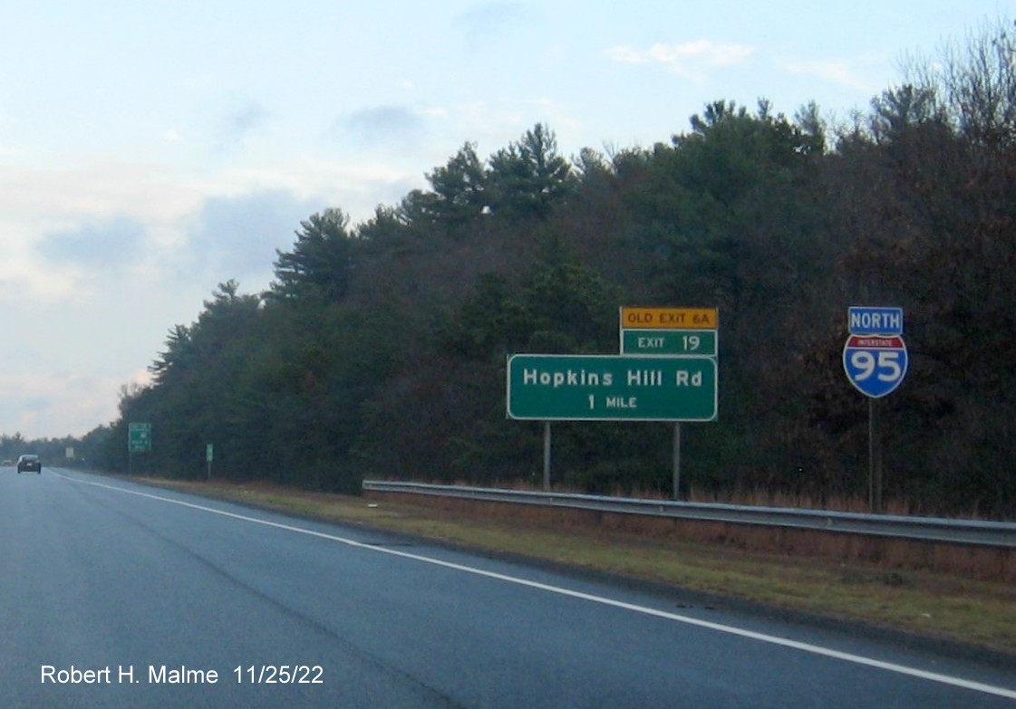 Image of ground mounted 1 mile advance sign for Hopkins Hill Road with new milepost based exit number and yellow Old Exit 6A on top of exit tab on I-95 North in West Greenwich, November 2022