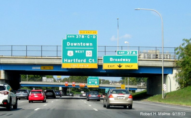 Image of 1/2 mile advance overhead sign for US 6 West/RI 10 and Downtown exits with new milepost based exit numbers on I-95 North in Providence, September 2022