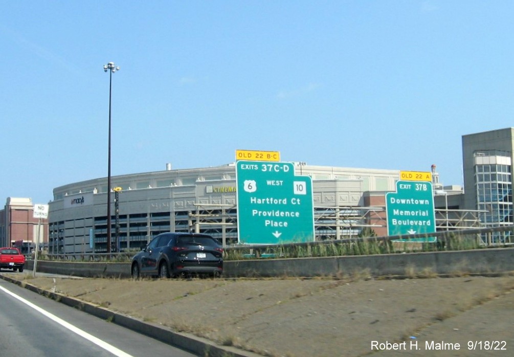 Image of overhead signage on exit ramp for US 6 West/RI 10 and Downtown exits with new milepost based exit numbers seen from I-95 North in Providence, September 2022