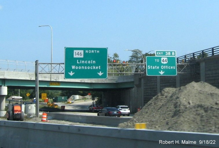Image of overhead ramp signage for RI 146 / US 44 exits with new milepost based exit number on I-95 North in Providence, September 2022