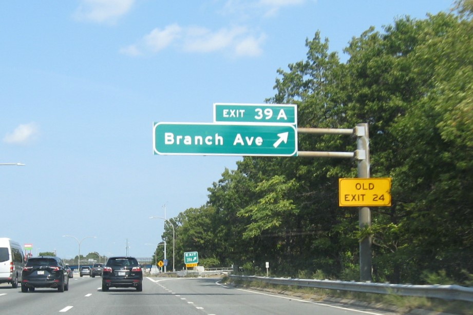 Image of bridge mounted overhead ramp sign for Branch Avenue exit with new milepost based exit number on I-95 North in Providence, September 2022