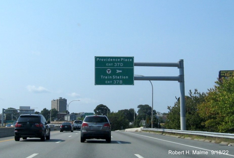Image of overhead auxiliary sign for US 6 West/RI 10 and Providence Place exits with new milepost based exit numbers on I-95 South in Providence, September 2022