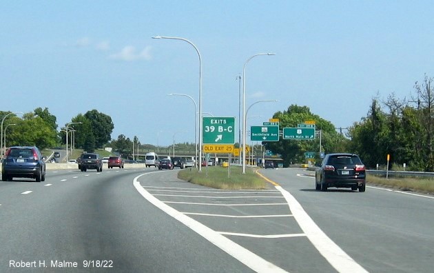Image of gore sign for US 1/RI 126 exits with new milepost based exit numbers and yellow Old Exit 25 sign below on I-95 North in Providence, September 2022