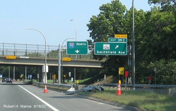 Image of overhead ramp sign for RI 126 exit with new milepost based exit number and yellow Old Exit 25B tab on top on I-95 North in Providence, September 2022