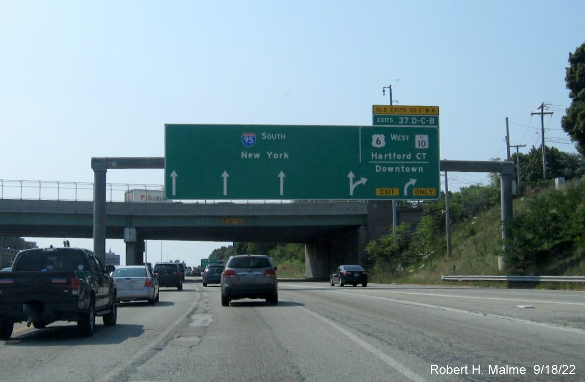 Image of 1/2 mile advance arrow-per-lane sign for US 6 West/RI 10 exit with new milepost based exit numbers and yellow Old Exit 22 A-C tab on top on I-95 South in Providence, September 2022