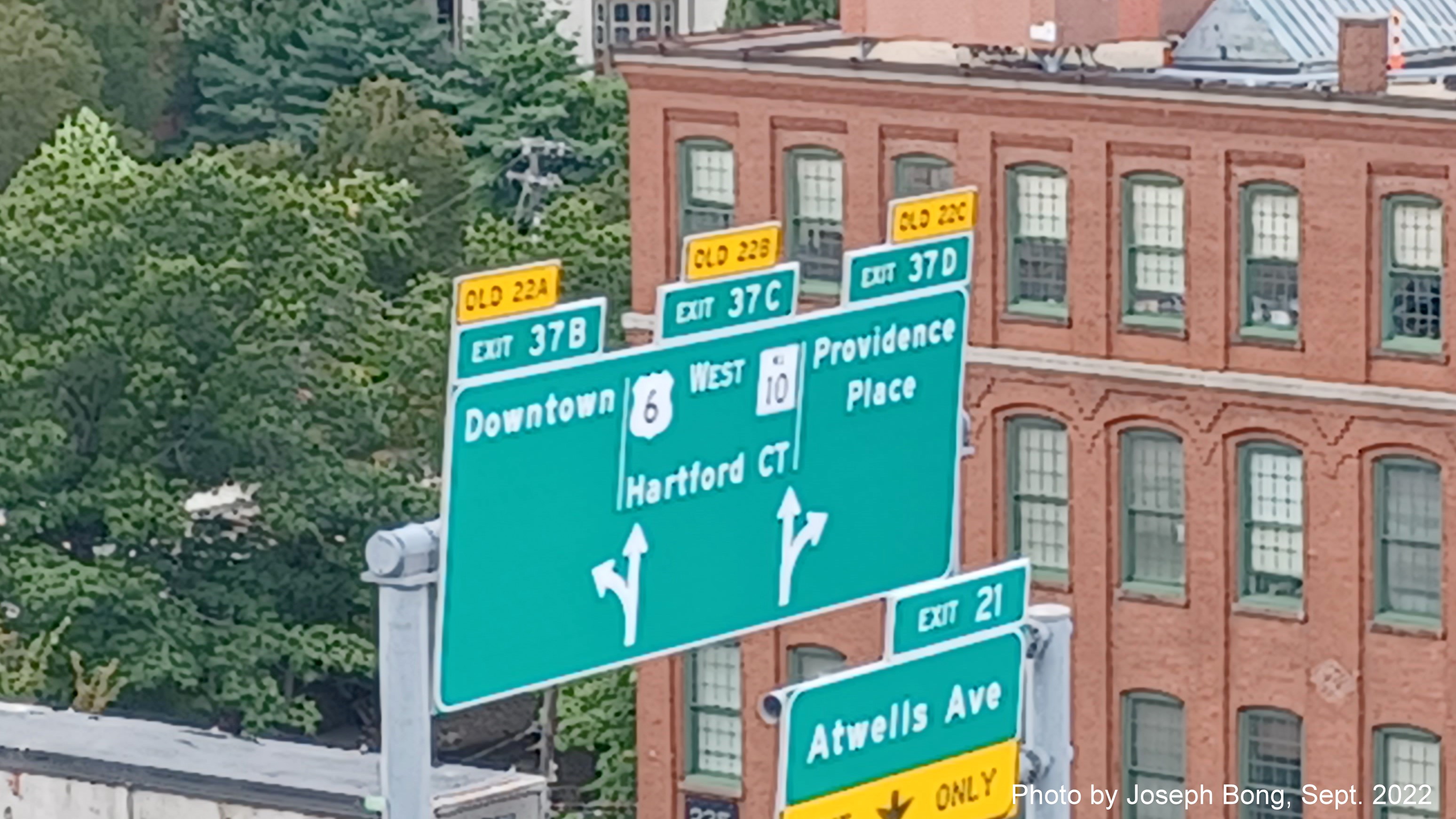Image of overhead signs for Downtown, US 6 West/RI 10 and Providence Place exits with new milepost based exit numbers,
                                         by Joseph Bong, September 2022