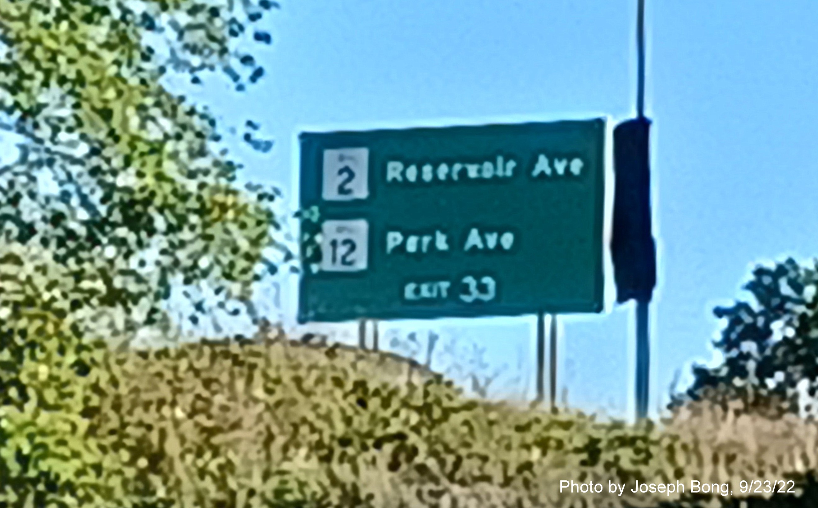 Image of auxiliary sign for RI 10 exits with new milepost based exit number (though no suffixes) on I-95 South in Cranston, by Joseph Bong, September 2022