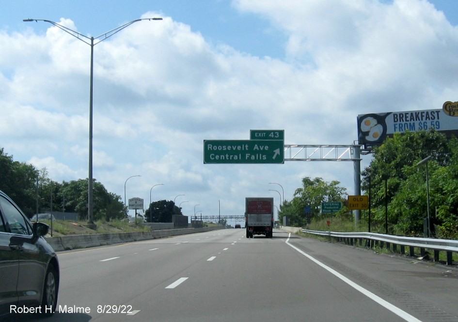 Image of recently placed overhead ramp sign for Roosevelt Avenue exit on I-95 South in Attleboro with newly placed milepost based exit number, August 2022