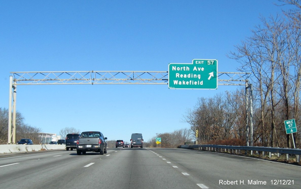 Image of overhead ramp sign for North Avenue exit with new milepost based exit number on I-95/MA 128 North in Reading, December 2021