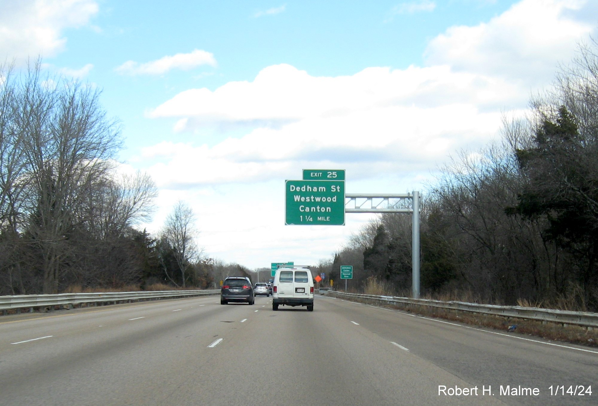 Image of recently placed 1 1/4 Miles advance sign for recently opened Dedham Street exit on I-95 North 
                                          in Canton, January 2024