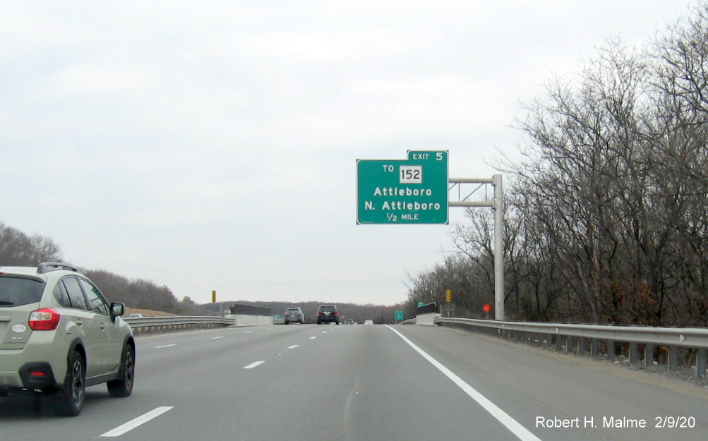 Image of orange contractor tag marking future location of 1/2 mile advance overhead sign for To MA 152 exit on I-95 North in North Attleboro