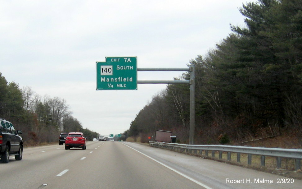 Image of orange contractor tag marking the future position of a 1/4 mile advance overhead sign for the MA 140 North exit on I-95 North in Foxboro
