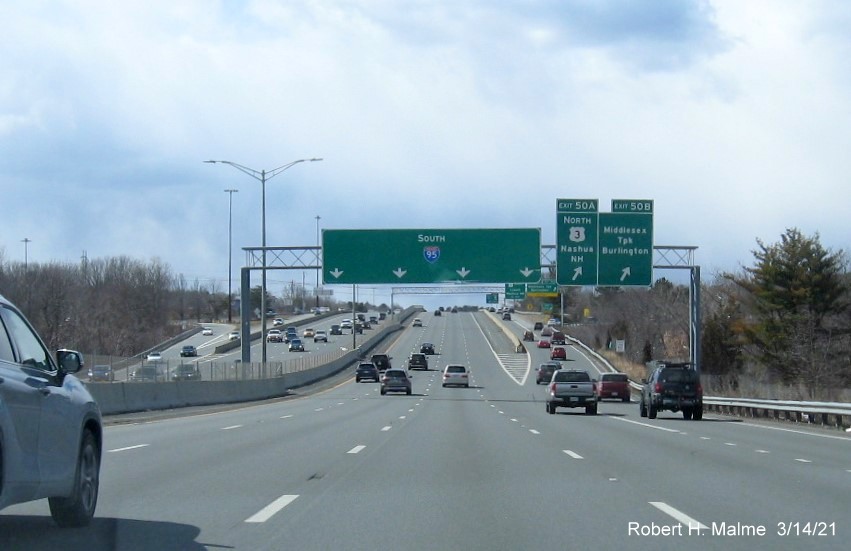 Image of overhead ramp signs for US 3 North/Middlesex Parkway exits with new milepost based exit numbers on I-95/MA 128 South in Burlington, March 2021