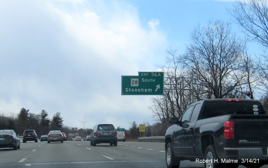 Image of overhead ramp sign for MA 28 South exit with new milepost based exit number on I-95/MA 128 South in Reading, March 2021