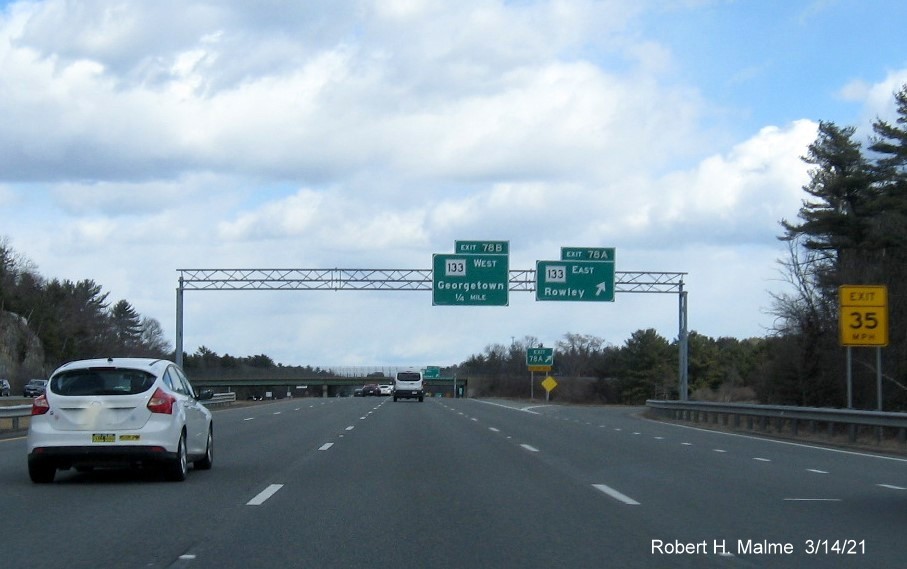 Image of overhead signage at ramp for MA 133 East exit with new milepost based exit number on I-95 North in Georgetown, March 2021 
