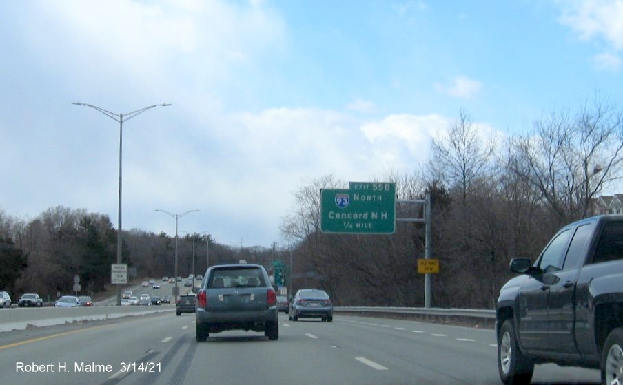 Image of 1/2 mile advance sign for I-93 North exit with new milepost based exit number and yellow Old Exit 37B advisory sign on support post on I-95/MA 128 South in Woburn, March 2021