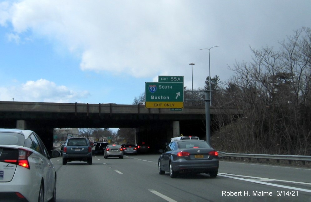Image of 1/2 mile advance sign for I-93 North exit with new milepost based exit number and yellow Old Exit 37B advisory sign on support post on I-95/MA 128 South in Woburn, March 2021
