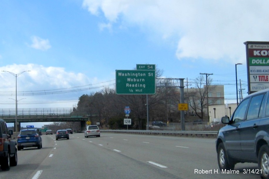 Image of 1/2 mile advance sign for Washington Street exit with new milepost based exit number and yellow Old Exit 36 sign on support on I-95/MA 128 South in Woburn, March 2021