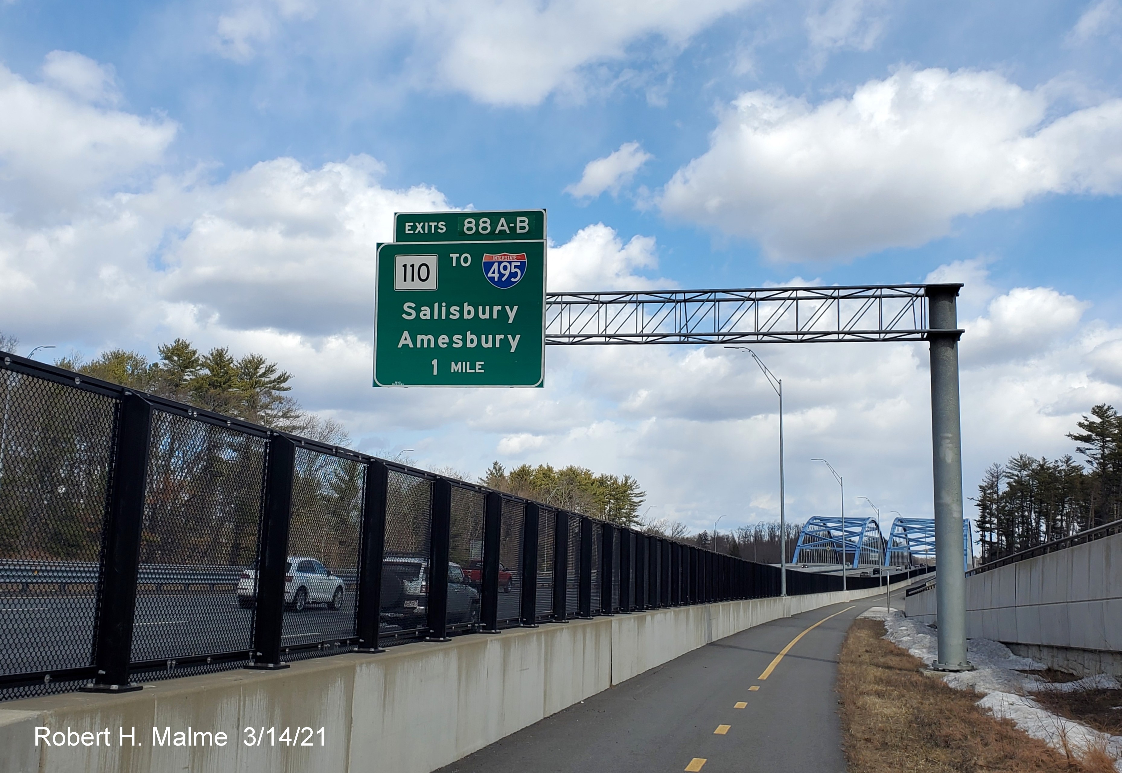 Image of 1 mile advance overhead sign for MA 110 exit with new milepost based exit number from Garrison Trail paralleling I-95 North in Newburyport, March 2021