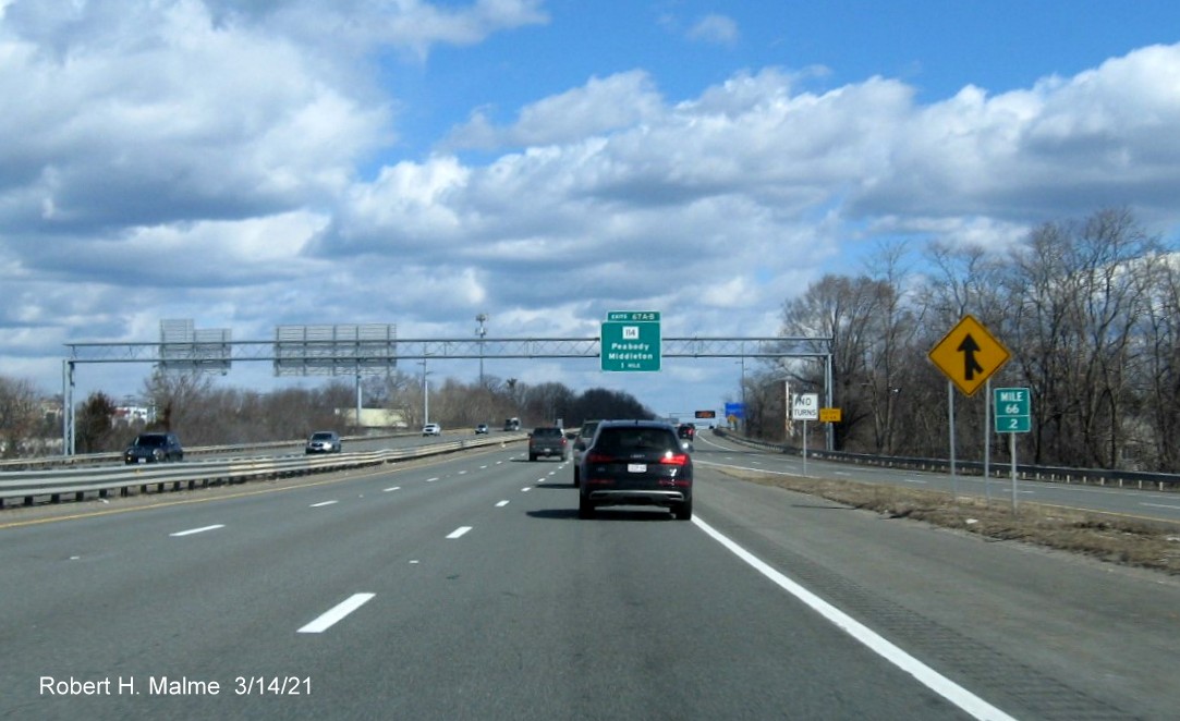 Image of 1 mile advance overhead sign for MA 114 exits with new milepost based exit numbers on I-95 North in Danvers, March 2021