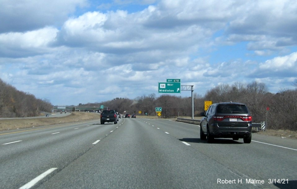 Image of overhead sign for MA 114 West exit with new milepost based exit number on I-95 North in Danvers, March 2021