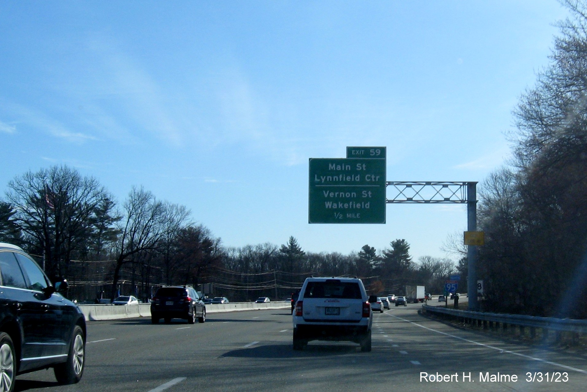 Image of recently placed 1/2 Mile overhead sign for the Main Street/Vernon Street exit on I-95/MA 128 North in Wakefield, March 2023