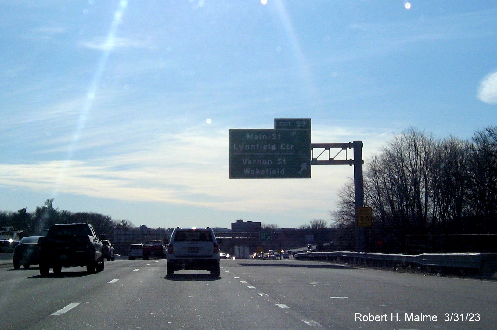 Image of recently placed overhead ramp sign for the Main Street/Vernon Street exit on I-95/MA 128 North in Wakefield, March 2023