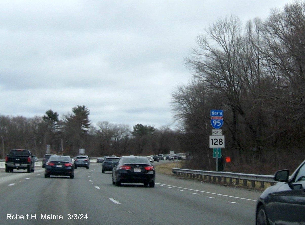 Image of North I-95/MA 128 reassurance marker after MA 129 exit in Wakefield with added white directional banner, March 2024