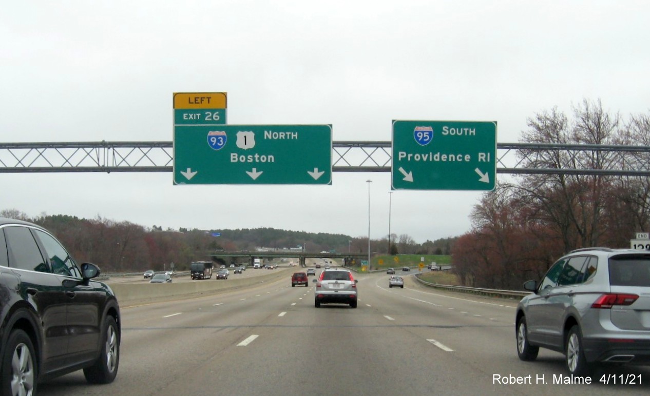 Image of overhead sign at North I-93/US 1 exit with new milepost based exit number on I-95/MA 128 South, US 1 North in Westwood, April 2021