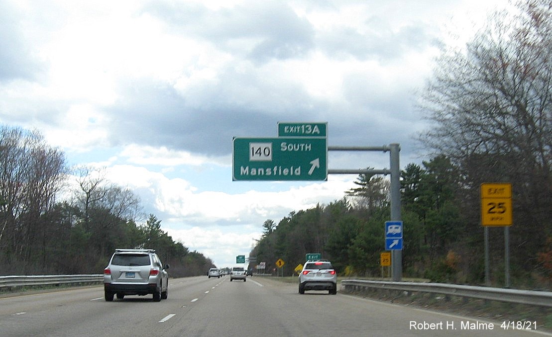Image of overhead ramp sign for MA 140 South exit with new milepost based exit number on I-95 South in Foxboro, April 2021