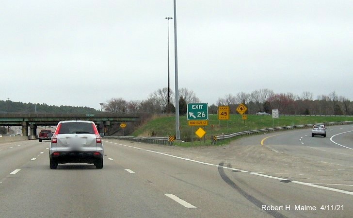Image of gore sign for North I-93/US 1 exit with new milepost based exit number and yellow Old Exit 12 sign attached below on I-95/MA 128 South, US 1 North in Westwood, April 2021 