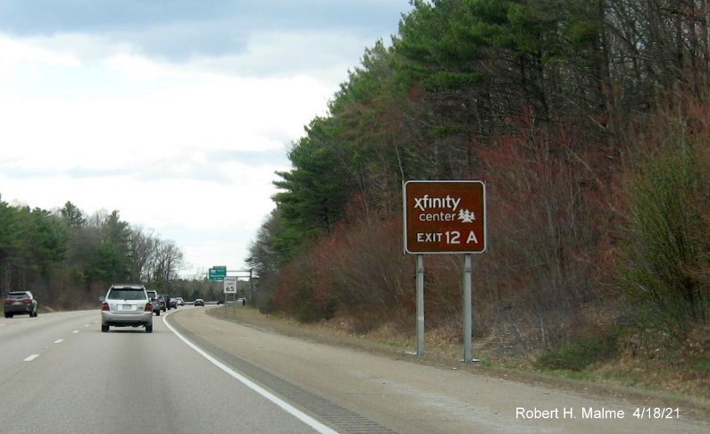 Image of brown attractions sign for I-495 South exit with new milepost based exit number on I-95 South in Foxboro, April 2021