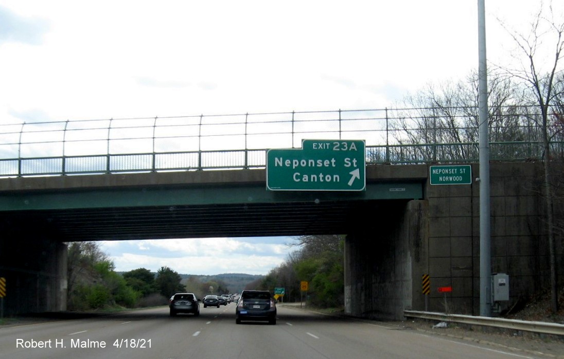Image of overhead ramp sign for Neponset Street east exit with new milepost based exit number on I-95 South in Norwood, April 2021