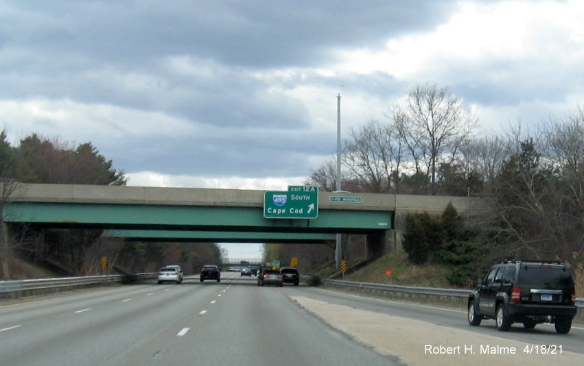 Image of overhead ramp sign for I-495 South exit with new milepost based exit number on I-95 South in Mansfield, April 2021