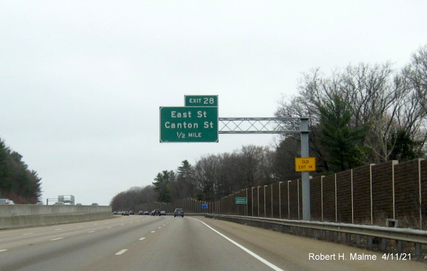 Image of 1/2 Mile advance for Canton Street/East Street exit with new milepost based exit number and yellow Old Exit 14 sign on support on I-95/MA 128 North, US 1 South in Canton, April 2021