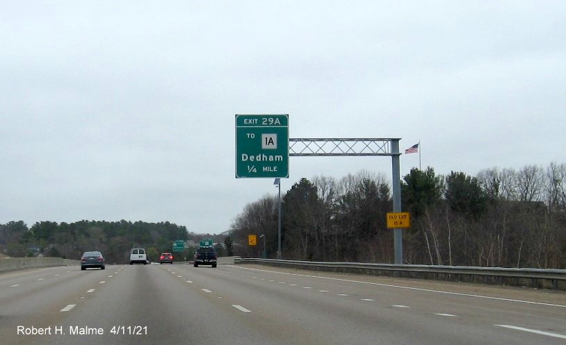 Image of 1/4 Mile advance sign for To MA 1A exit with new milepost based exit number and yellow Old Exit 15 A advisory sign on support on I-95/MA 128 North, US 1 South in Westwood, April 2021