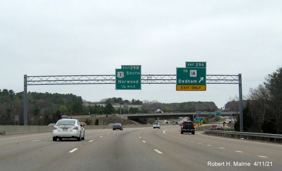 Image of overhead signage at ramp for US 1/MA 1A exits with new milepost based exit numbers on I-95/MA 128 North, US 1 South in Dedham, April 2021