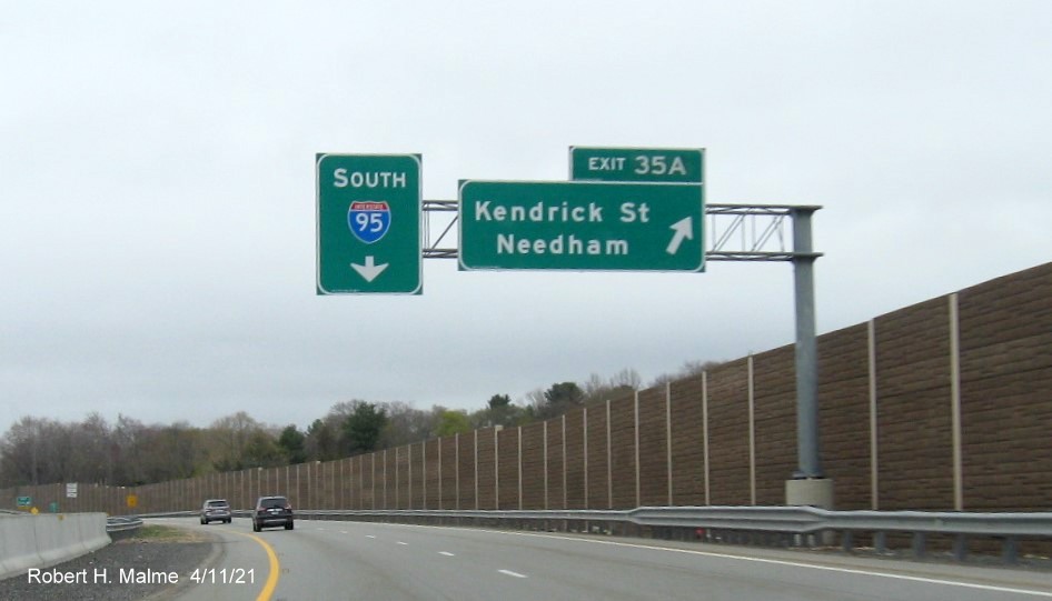 Image of overhead signage at ramp to Kendrick Street exit with new milepost based 
                                            exit number on C/D ramp from I-95/MA 128 South in Needham, April 2021