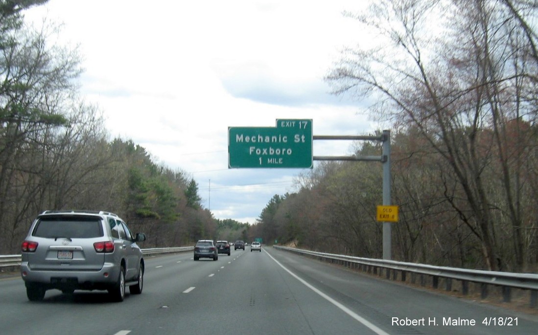 Image of 1 mile advance overhead sign for Mechanic Street exit with new milepost exit number and yellow Old Exit 8 advisory sign on I-95 South in Foxboro, April 2021