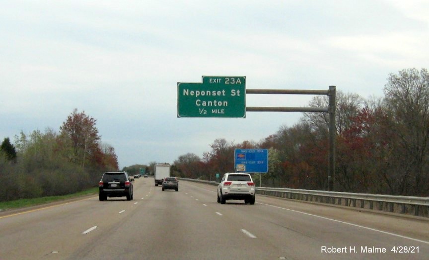 Image of 1/2 mile advance overhead sign for Neponset Street, Norwood exit with new milepost based exit number on I-95 North in Sharon, April 2021
