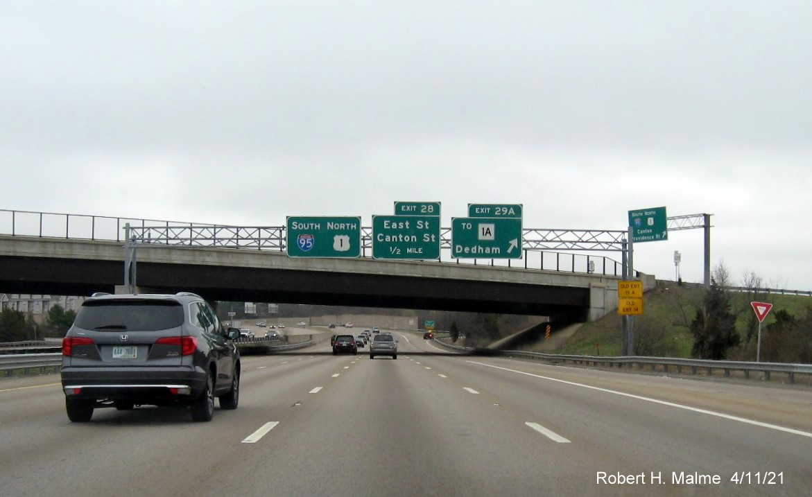 Image of overhead signage at ramp for To MA 1A exit with new milepost based exit numbers on I-95/MA 128 South in Dedham, April 2021