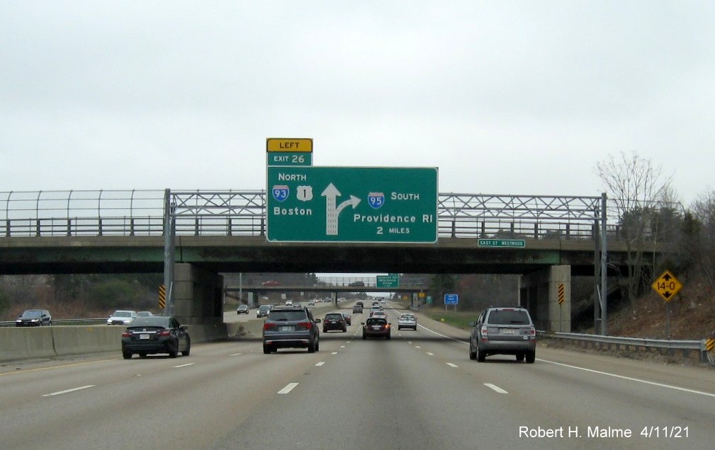 Image of 2 Miles advance overhead diagrammatic sign for North I-93/US 1 exit with new milepost based exit number on I-95/MA 128 South, US 1 North in Westwood, April 2021 
